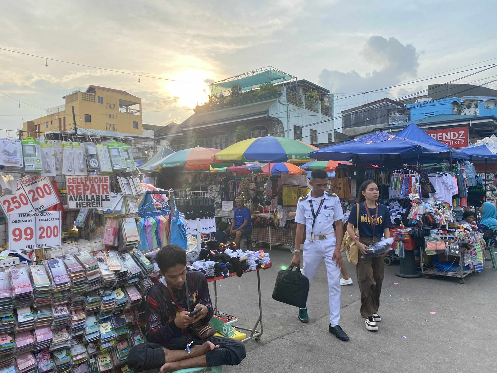 Ambulant vendor stall setup selling rice, dried fish, beans and grains at a temporary location